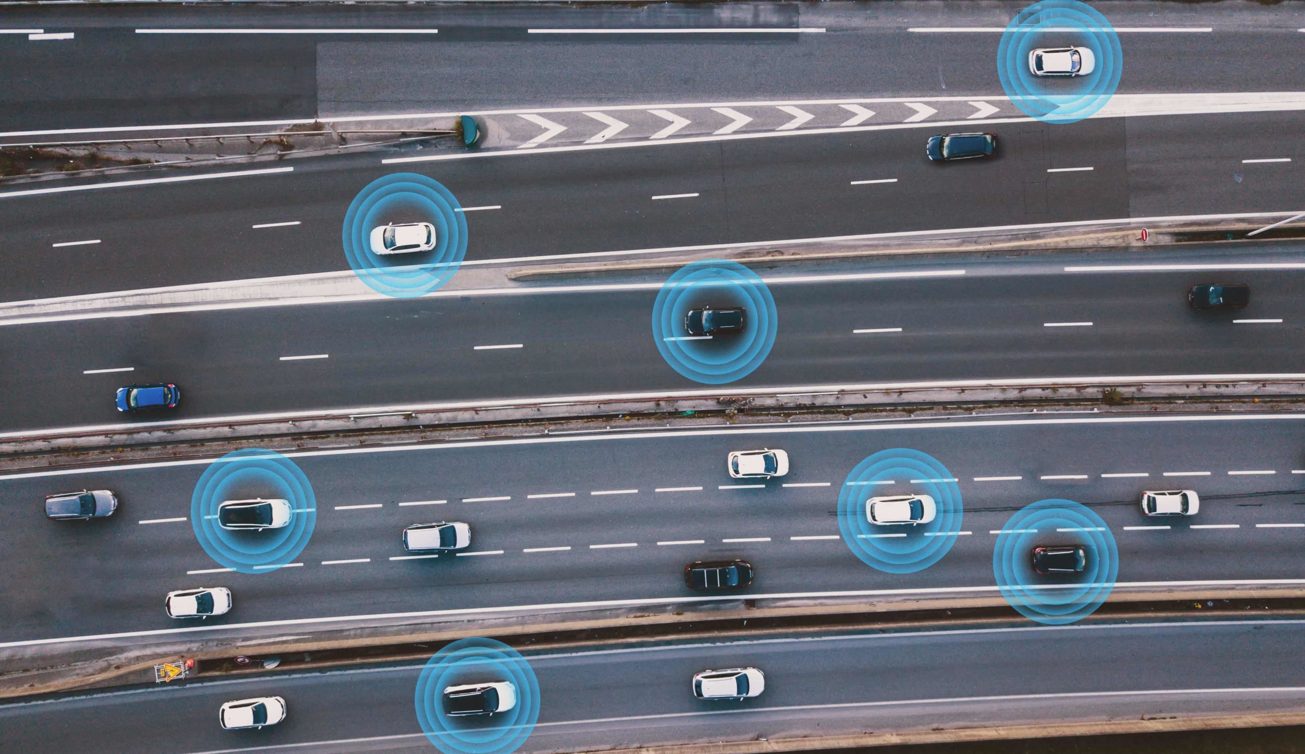 Connected vehicles: Cars driving on the highway communicating with one another